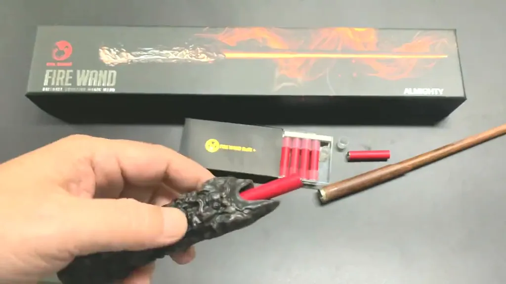 Fire Wand – Smoke Refill 3 Sliding a red smoke cartridge into the handle of the Almighty Wand Pro